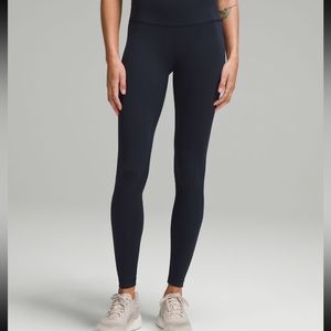 Wunder train contour fit high-rise tight 25” true navy